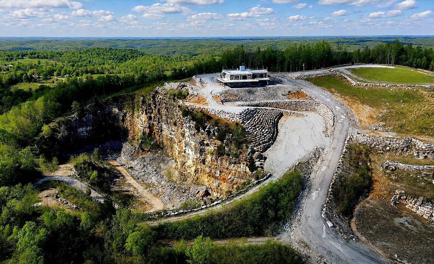Aerial view of the retired quarry cliff with the restaurant built on the ledge above