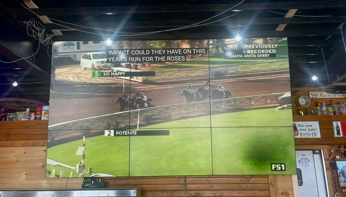 Big screen showing live sports at the bar